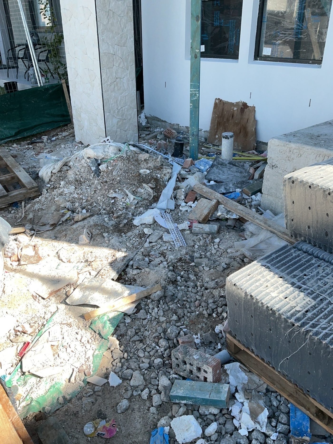 Site recorded as unsafe with debris across the floor, found during a lock-up inspection in Cobbitty
