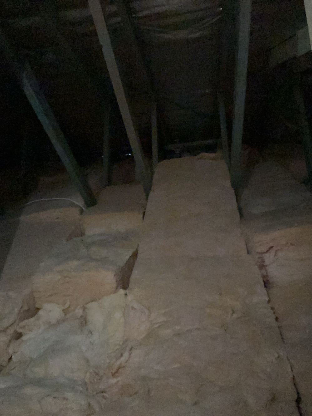 Roof sarking cut and left unrepaired, found during a handover inspection in Cobbitty