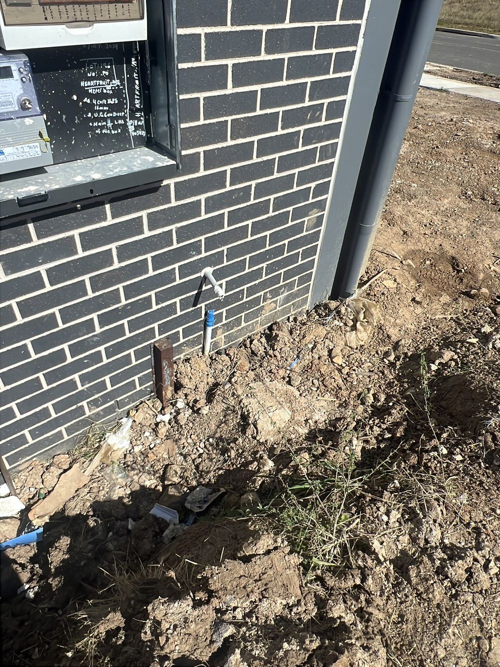 Weep holes less than the required height above the ground, found during a handover inspection in Cobbitty