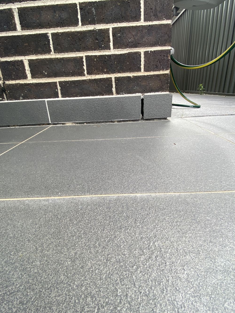 Movement in the alfresco slab opening a gap at the skirting tile, Casula, Cobbitty