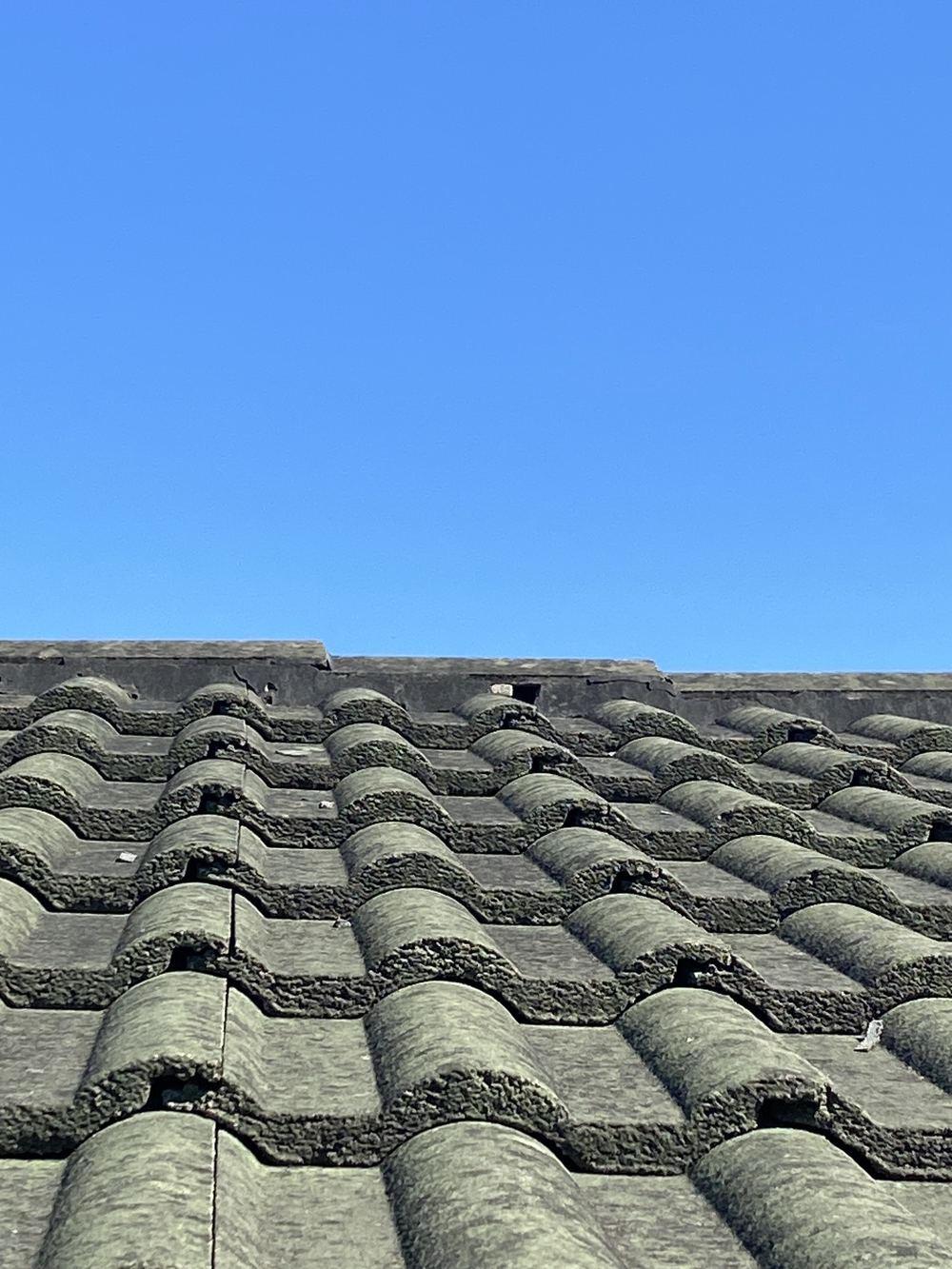 Ridge pointing eroded with gaps opening along the joints, found during a pre-purchase inspection in Horningsea Park