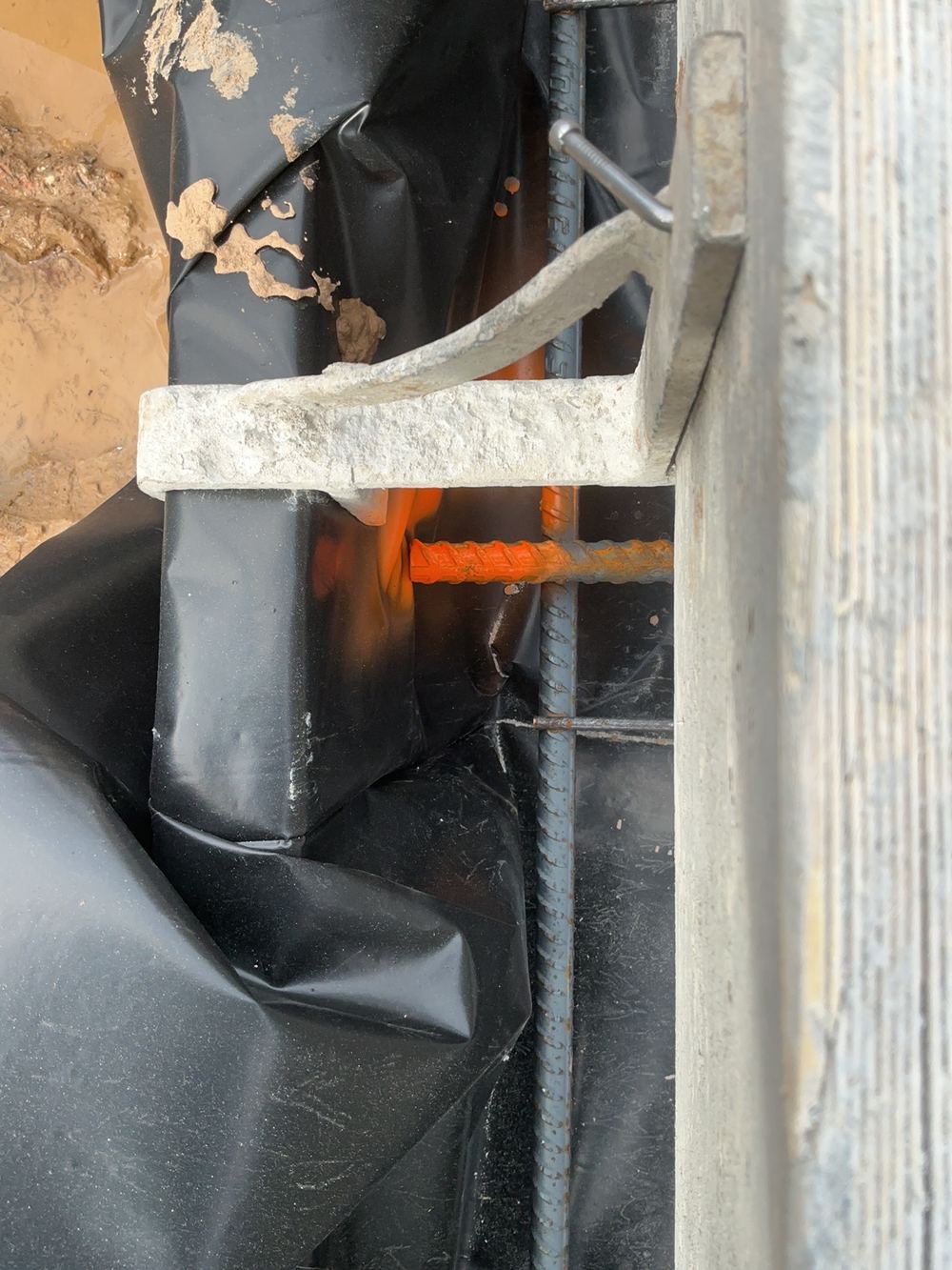 Steel with less concrete cover than the minimum required, found during a slab pre-pour inspection in Spring Farm